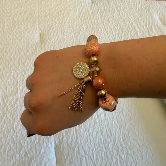 Beaded Stretch Bracelet w/ Gold Charms – Pink & Gold (Imperfection on tassel) - Picture 4 of 8